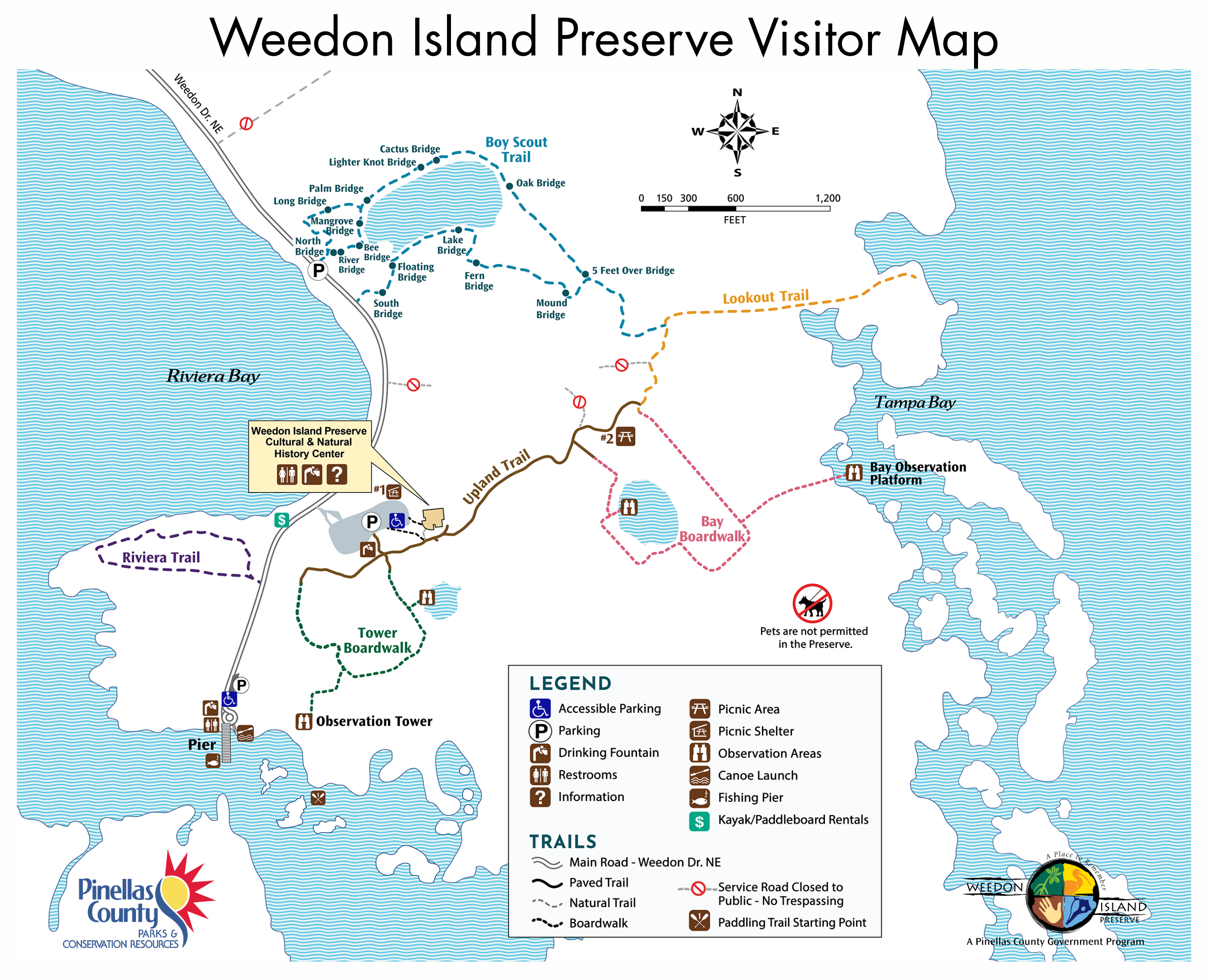 Weedon Island Preserve Trail Map - Map shows six trails, an observation tower, a fishing pier, a canoe launch, picnic shelter and picnic area, restrooms, parking, drinking fountains, and bridges within the preserve.